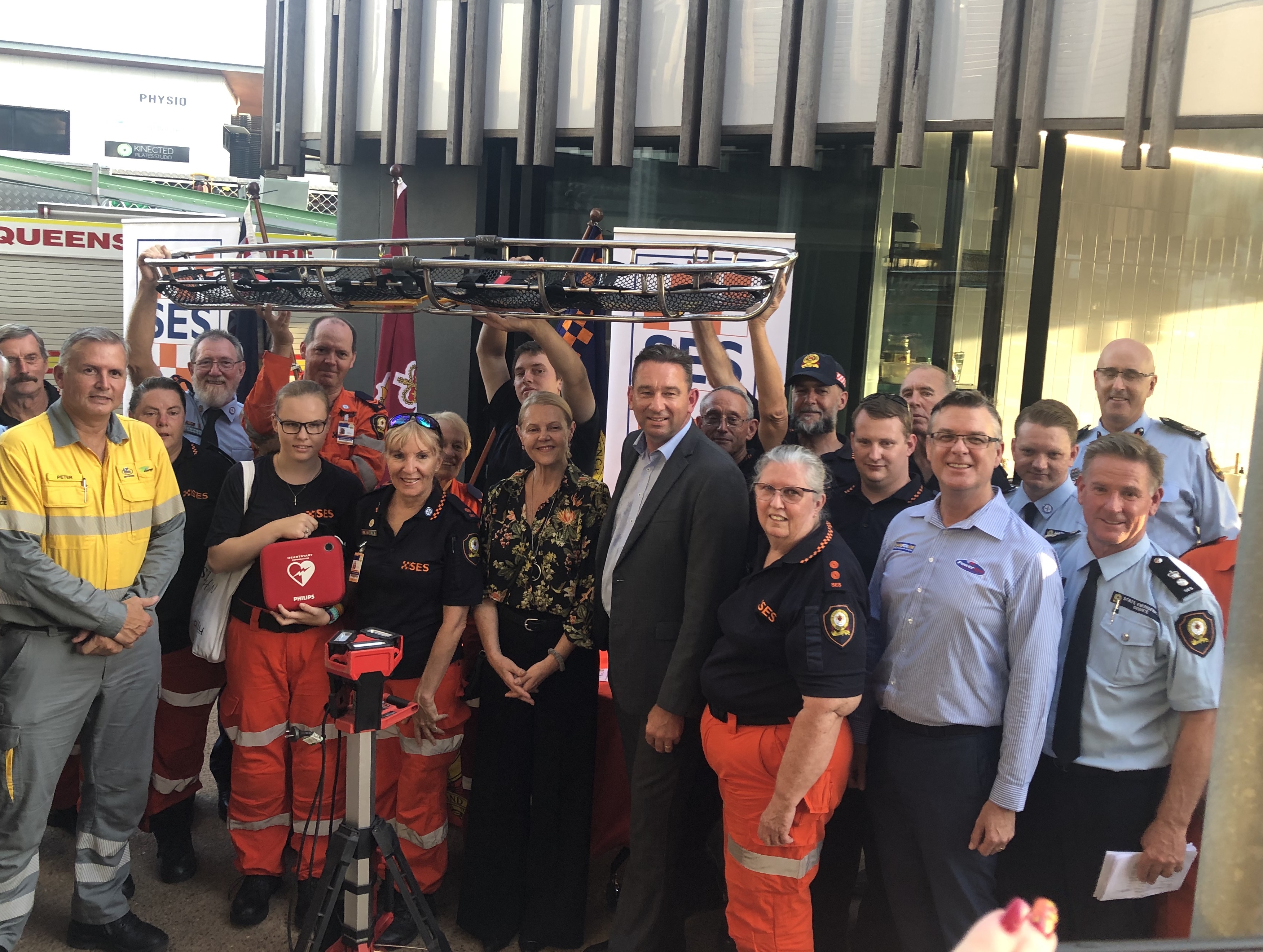 SES and partnership representatives with new equipment