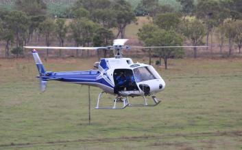 helicopter inspecting line