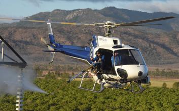 Helicopter inspection performing insulator washing