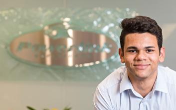 Team member smiling at camera