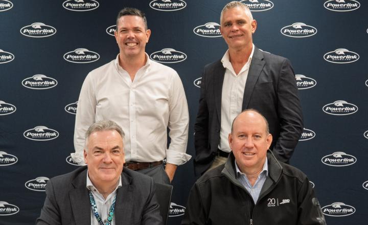 Four men smiling