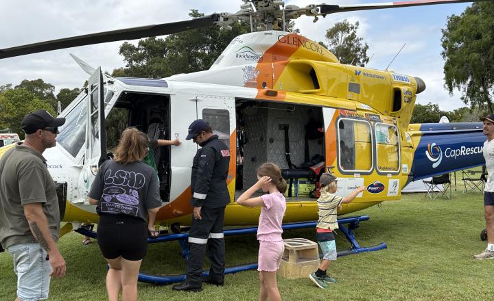 people looking at helicopter