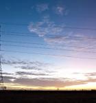 Transmission tower at sunset