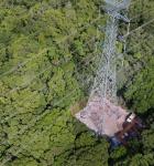 Transmission tower surrounded by trees 